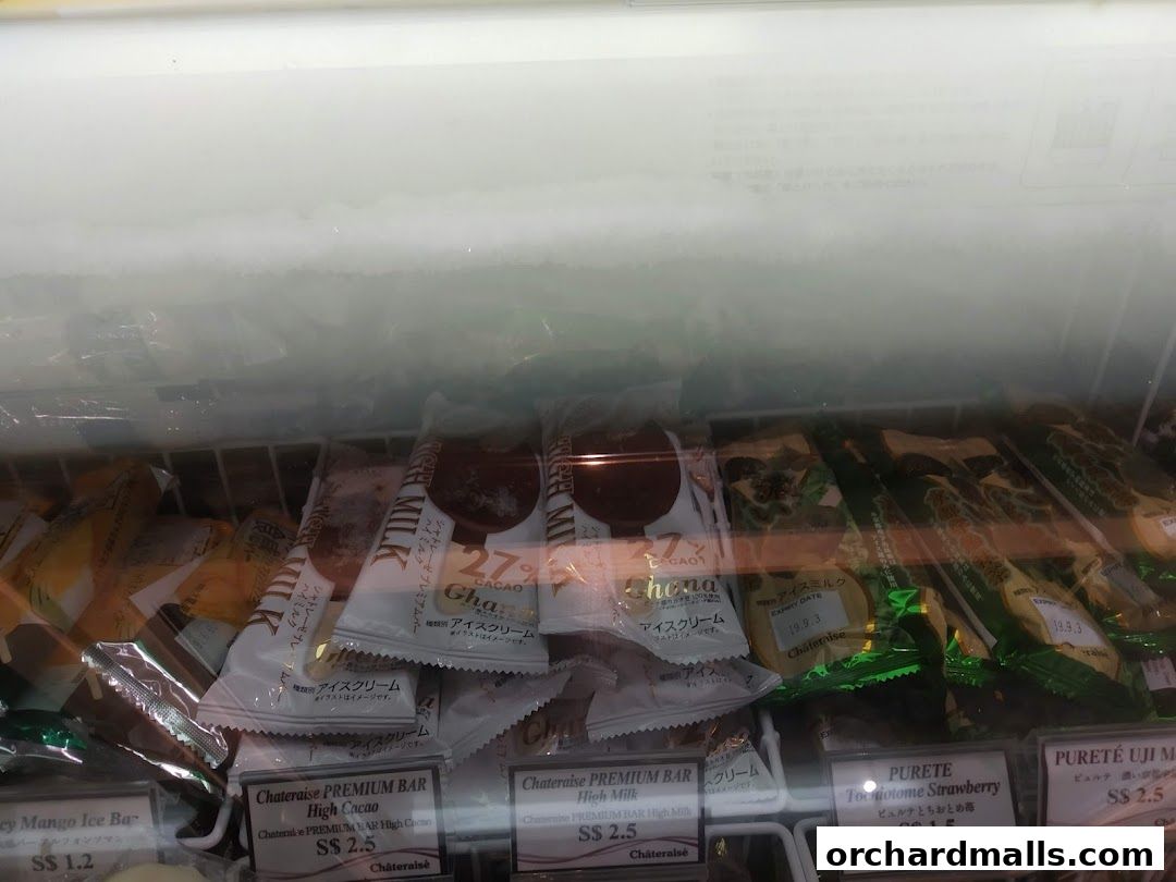 A freezer display case filled with individually wrapped ice cream bars from Châteraisé.