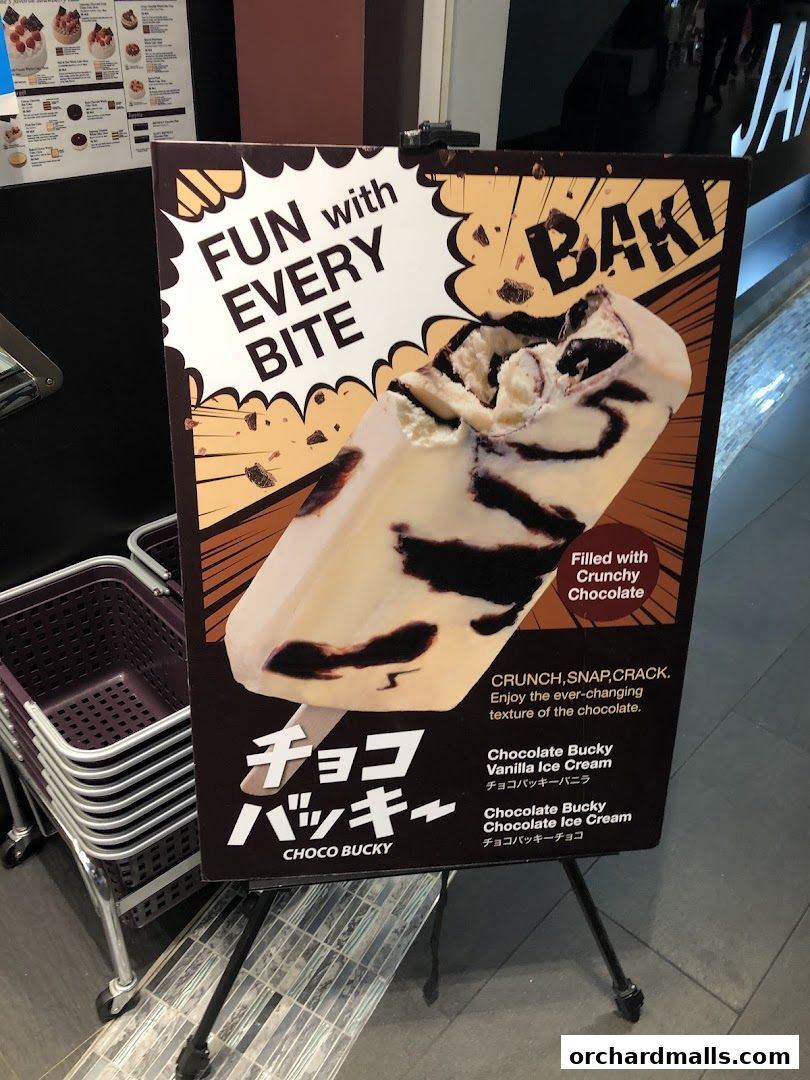 A sign advertising Choco Bucky ice cream with the slogan 'Fun with Every Bite'.