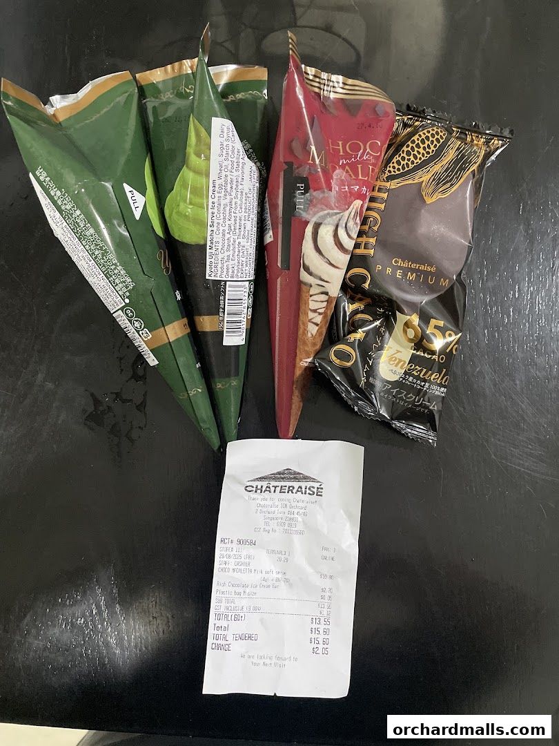 A collection of Châteraisé ice cream cones and a receipt on a dark surface.