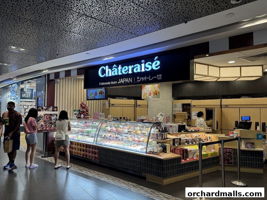 A Châteraisé patisserie shop with a display of colorful cakes and pastries.