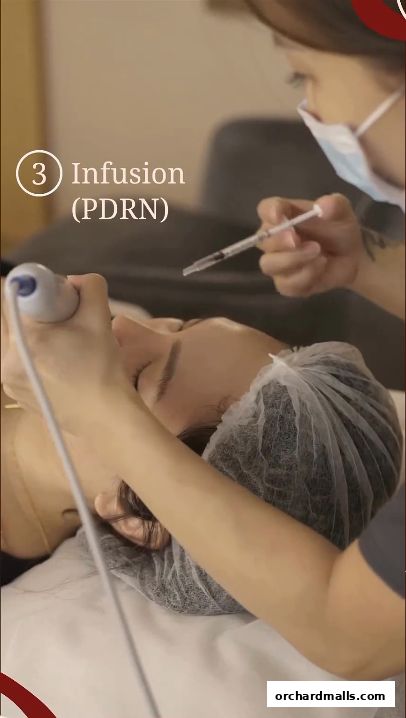 Aesthetician performing a PDRN infusion treatment on a client's face.