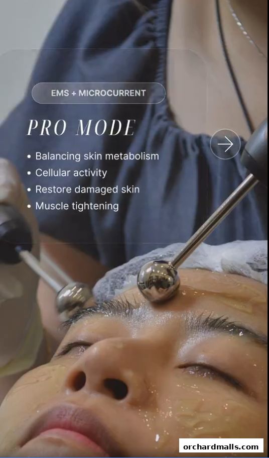 A close-up of a person receiving a facial treatment with EMS and microcurrent technology.
