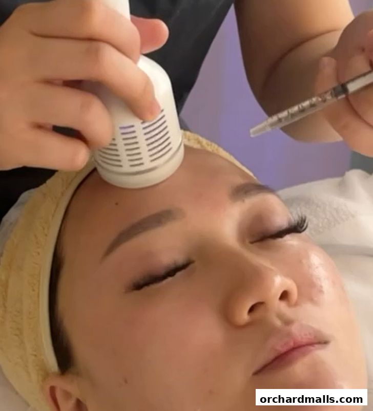 A close-up of a woman receiving a facial treatment with a device and a syringe.