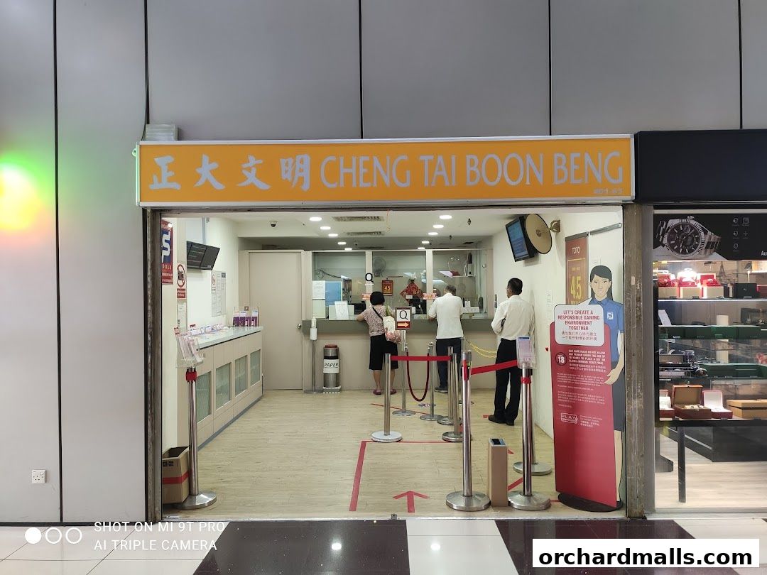 The entrance of Cheng Tai Boon Beng, a Singapore Pools authorized retailer, with staff and customers inside.