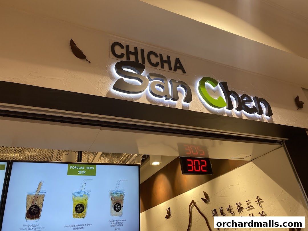 The CHICHA San Chen shop front with illuminated signage and a digital display.