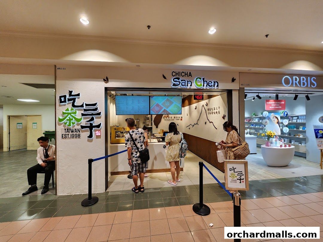 The exterior of CHICHA San Chen, a Taiwanese bubble tea shop, with customers queuing.