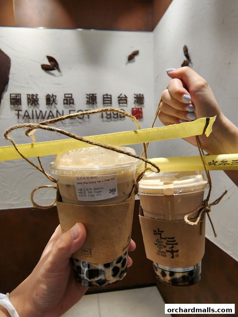 Two bubble tea drinks from CHICHA San Chen, one with a label showing drink details.