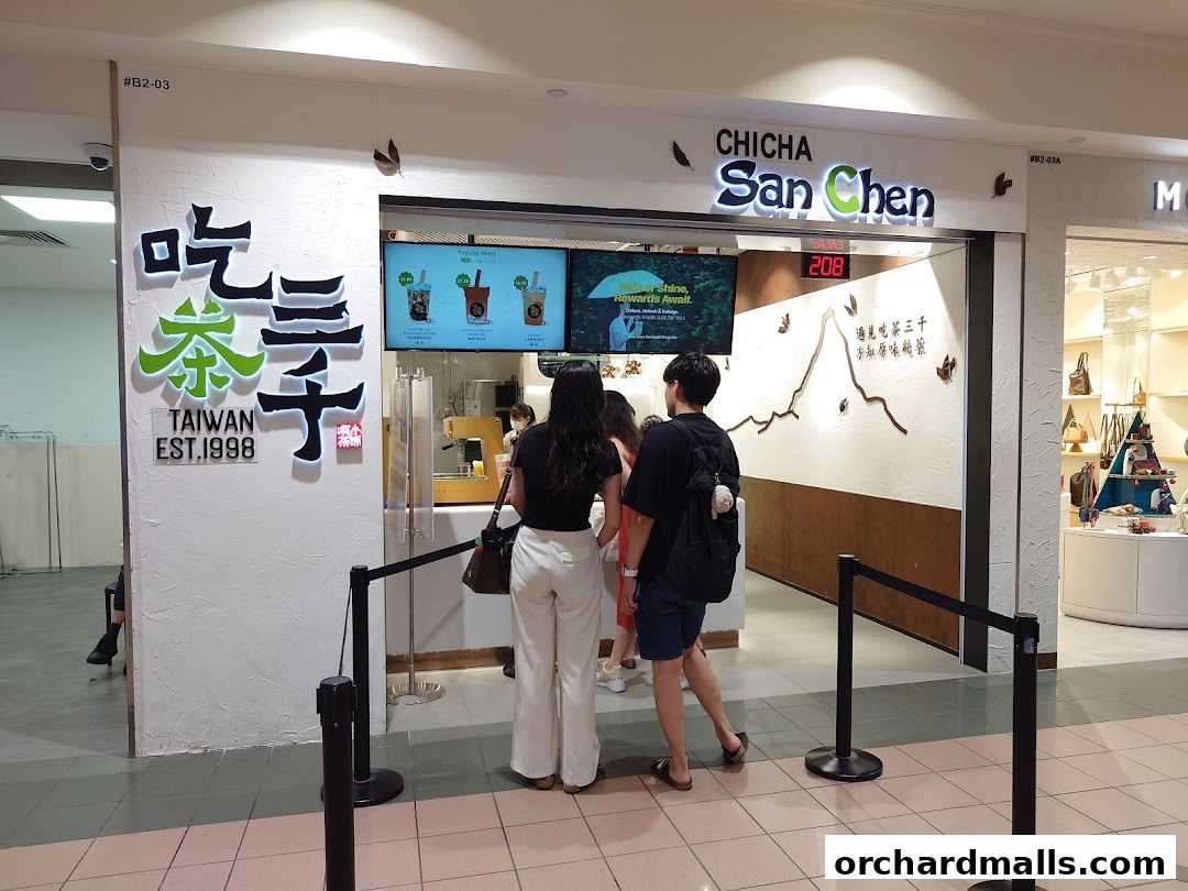 The exterior of CHICHA San Chen, a Taiwanese bubble tea shop, with customers queuing.