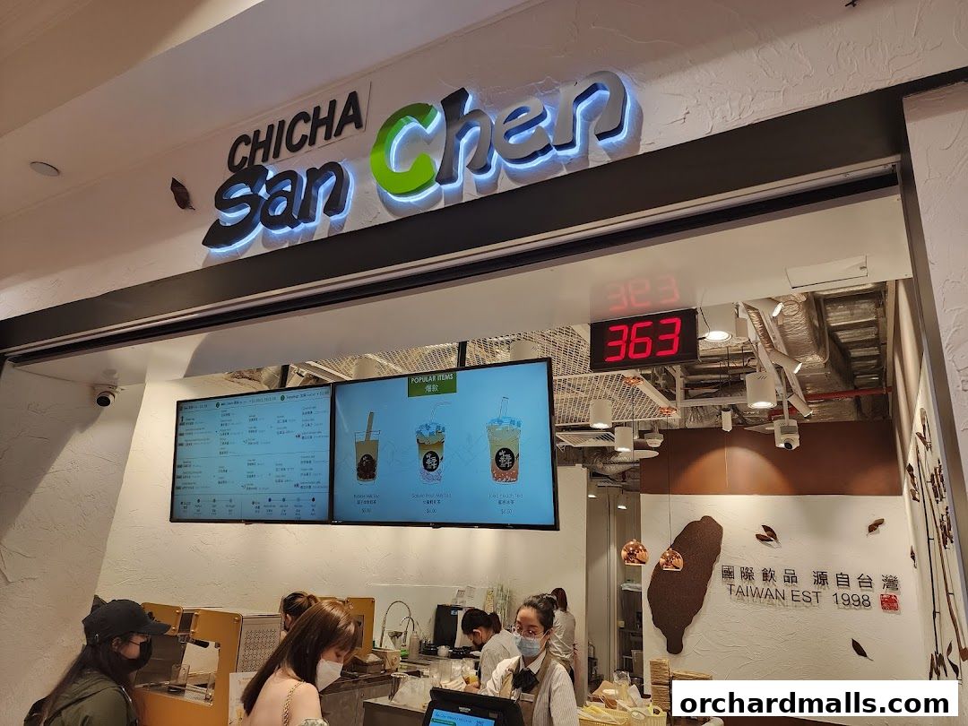 The entrance of CHICHA San Chen bubble tea shop with a menu displayed.