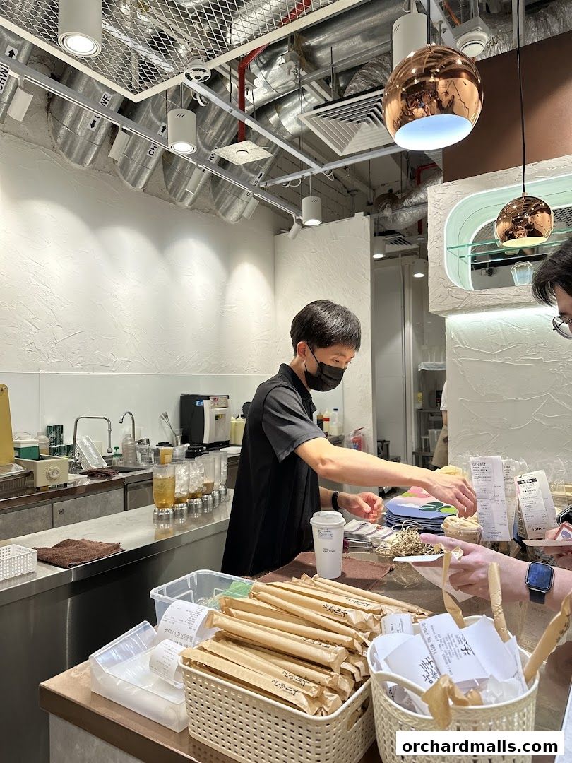 A staff member prepares drinks behind a counter at CHICHA San Chen.