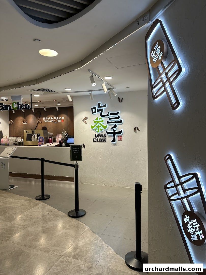 The entrance to CHICHA San Chen, a Taiwanese bubble tea shop, with illuminated signage.