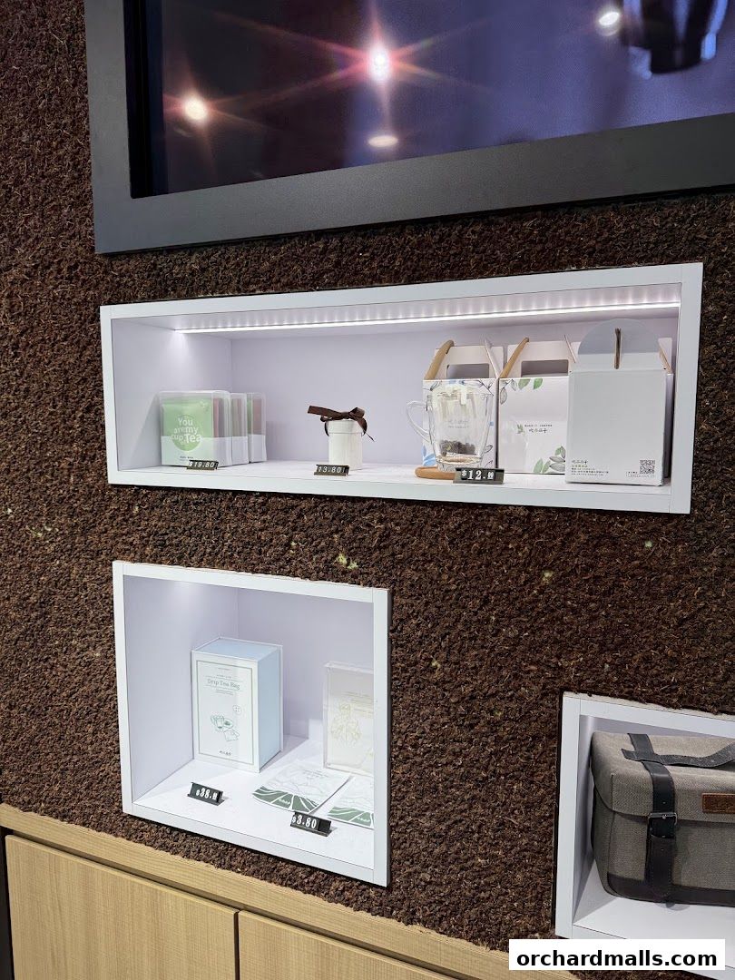 Display shelves showcasing tea products and accessories at CHICHA San Chen.