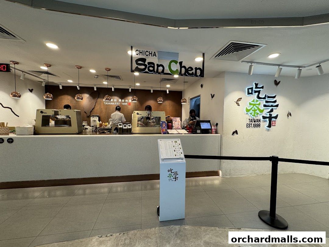 The interior of a CHICHA San Chen tea shop with staff preparing drinks behind the counter.