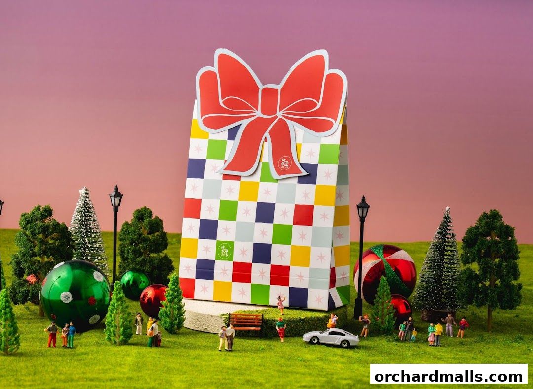 A festive gift bag with a red bow sits in a miniature park setting.