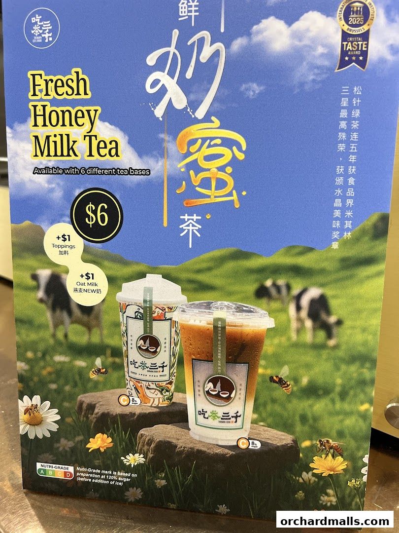 A poster advertising CHICHA San Chen's Fresh Honey Milk Tea with pricing and topping options.