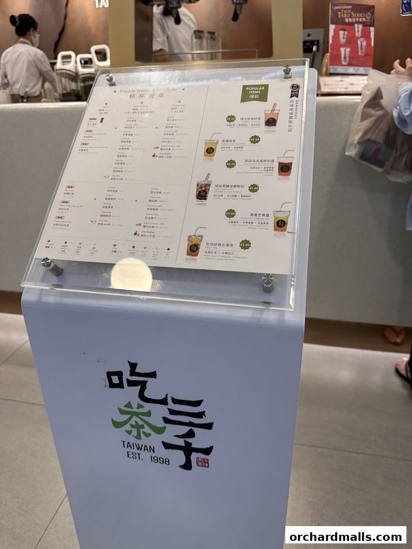 A menu board for CHICHA San Chen displaying popular bubble tea drinks and their prices.