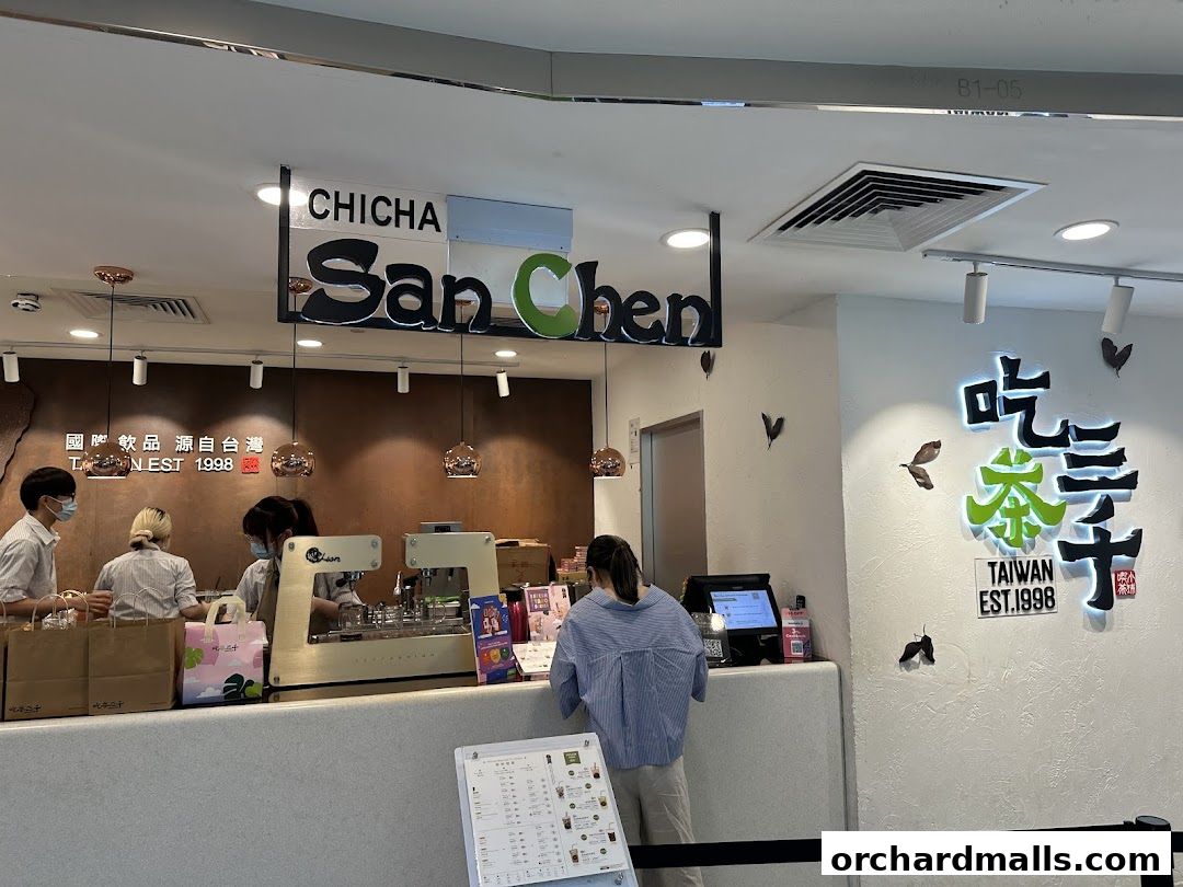 Interior view of CHICHA San Chen tea shop with staff serving customers.