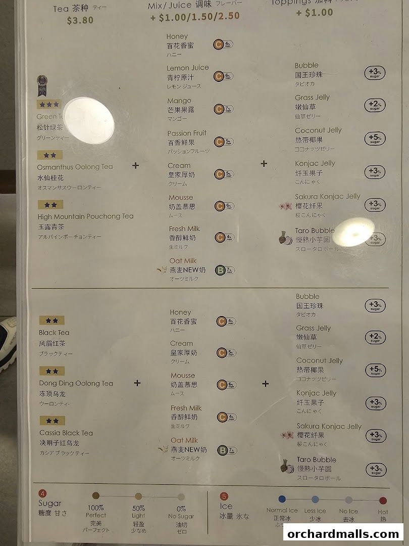 A menu displaying various tea, juice, and topping options with prices and descriptions.