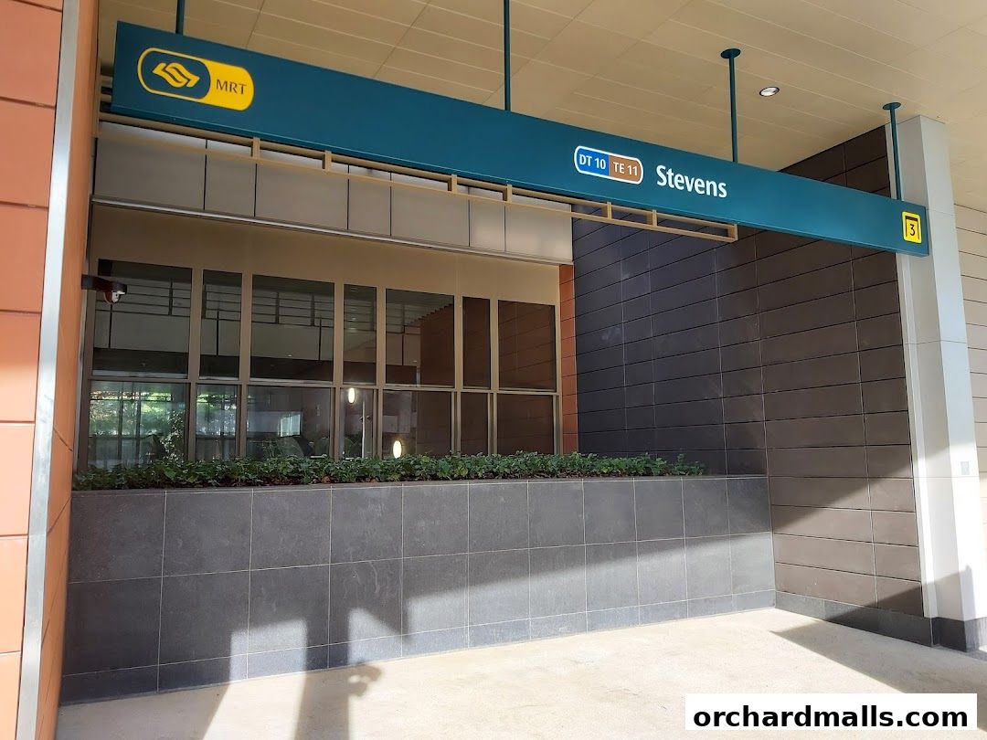 An MRT station entrance sign for Stevens station with route numbers DT10 and TE11.