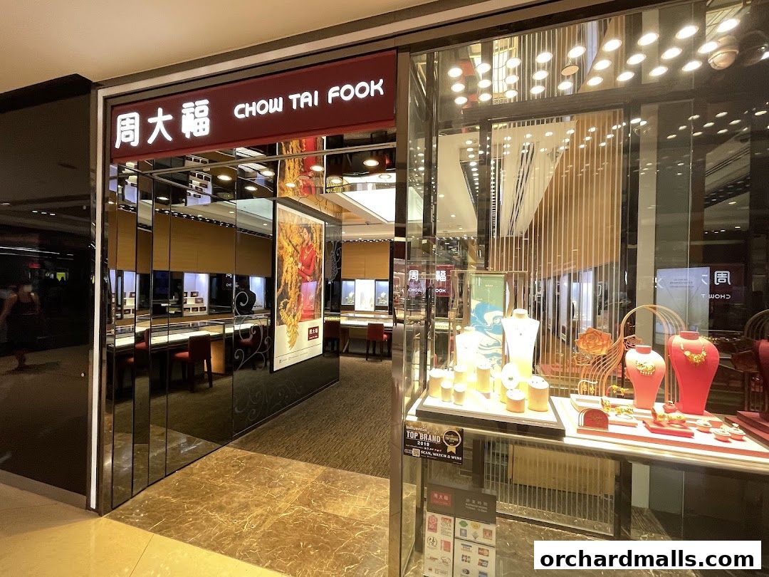 The entrance of Chow Tai Fook Jewellery, showcasing elegant displays of necklaces and jewelry.