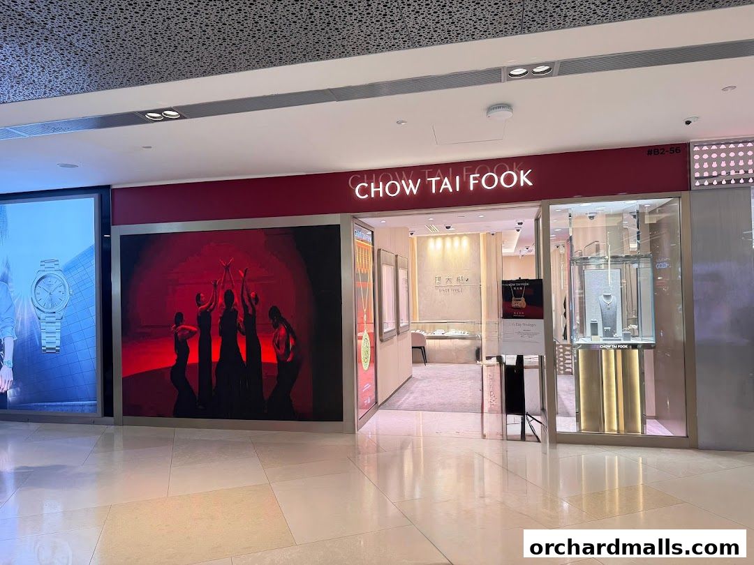 The exterior of the Chow Tai Fook Jewellery store at ION Orchard, showcasing its entrance and display windows.
