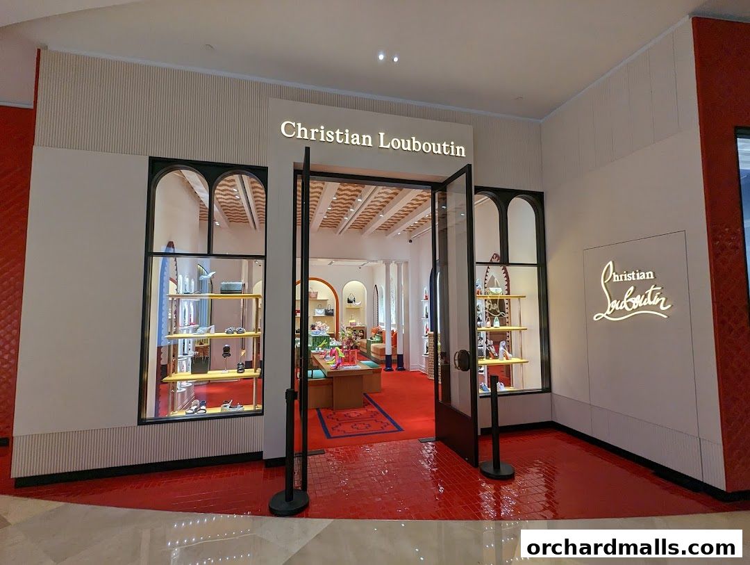 The entrance to the Christian Louboutin Singapore ION Orchard store, showcasing luxury footwear and accessories.