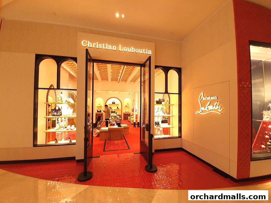 The entrance to the Christian Louboutin Singapore ION Orchard store, showcasing luxury footwear and accessories.