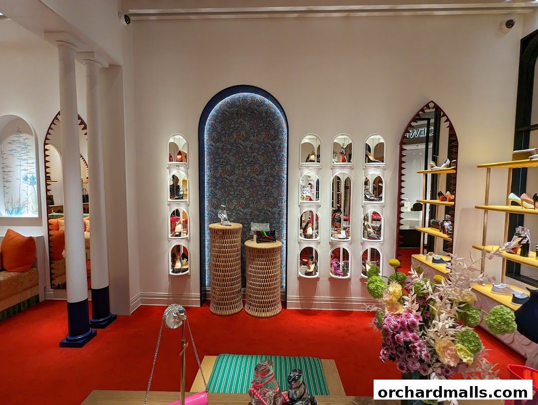 Interior view of a Christian Louboutin store showcasing shoes and handbags on display.