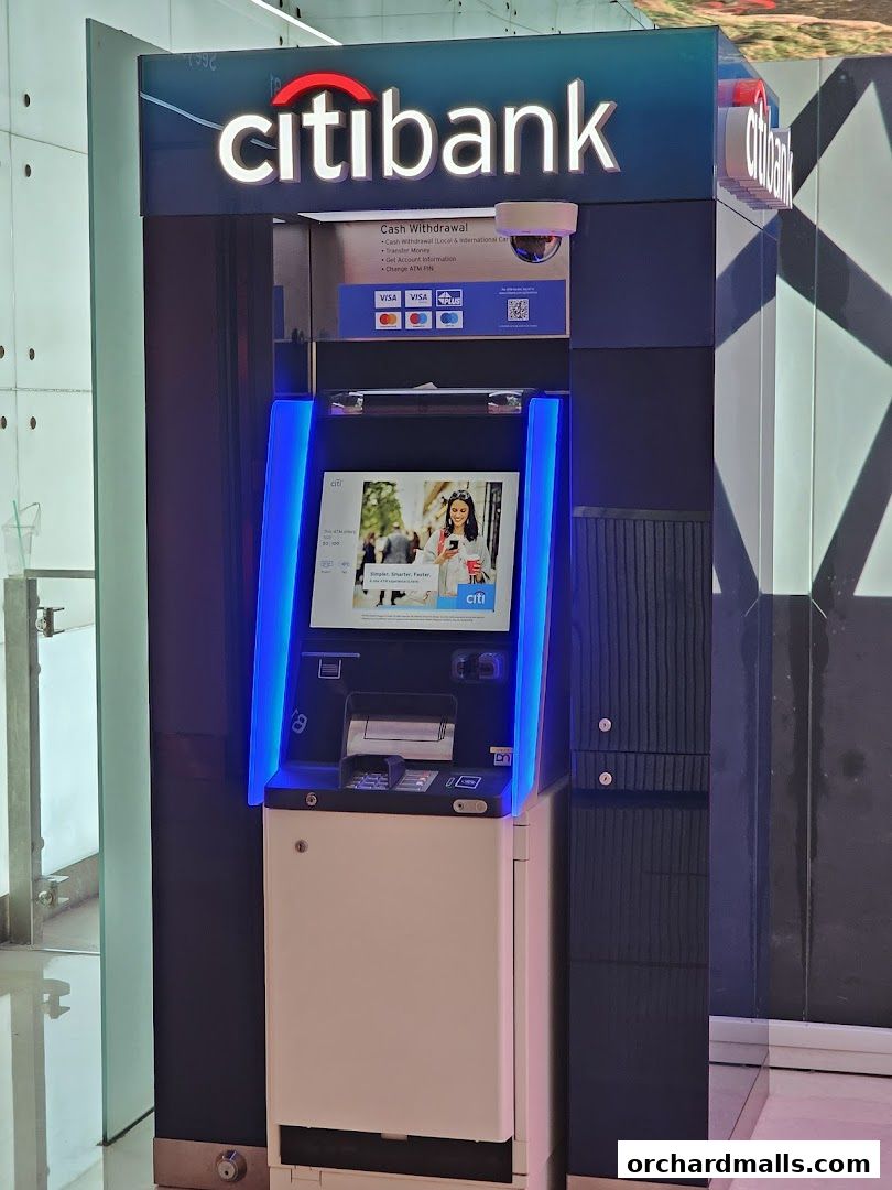 A Citibank ATM machine with illuminated branding and a touch screen display.
