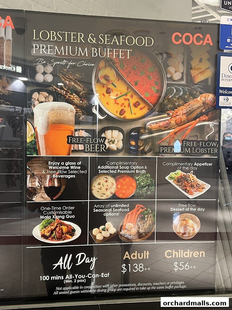A menu board advertising a Lobster & Seafood Premium Buffet with various inclusions and pricing.