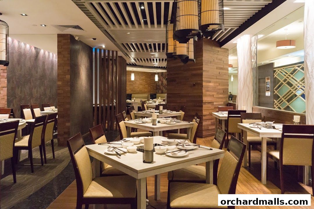 Interior of a restaurant with tables set for dining and modern decor.