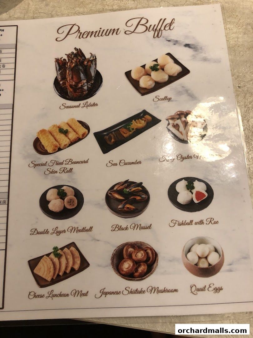 A menu showcasing a premium buffet with various seafood and meat dishes.