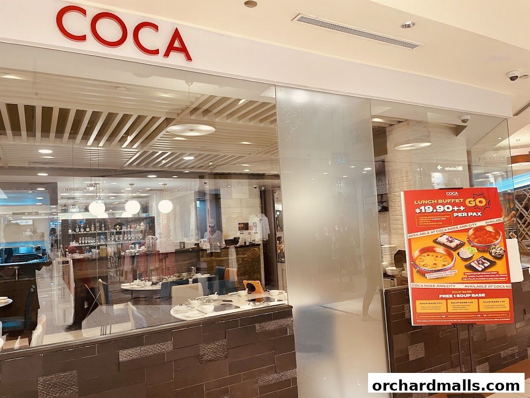 The exterior of the COCA restaurant with a lunch buffet promotion sign.