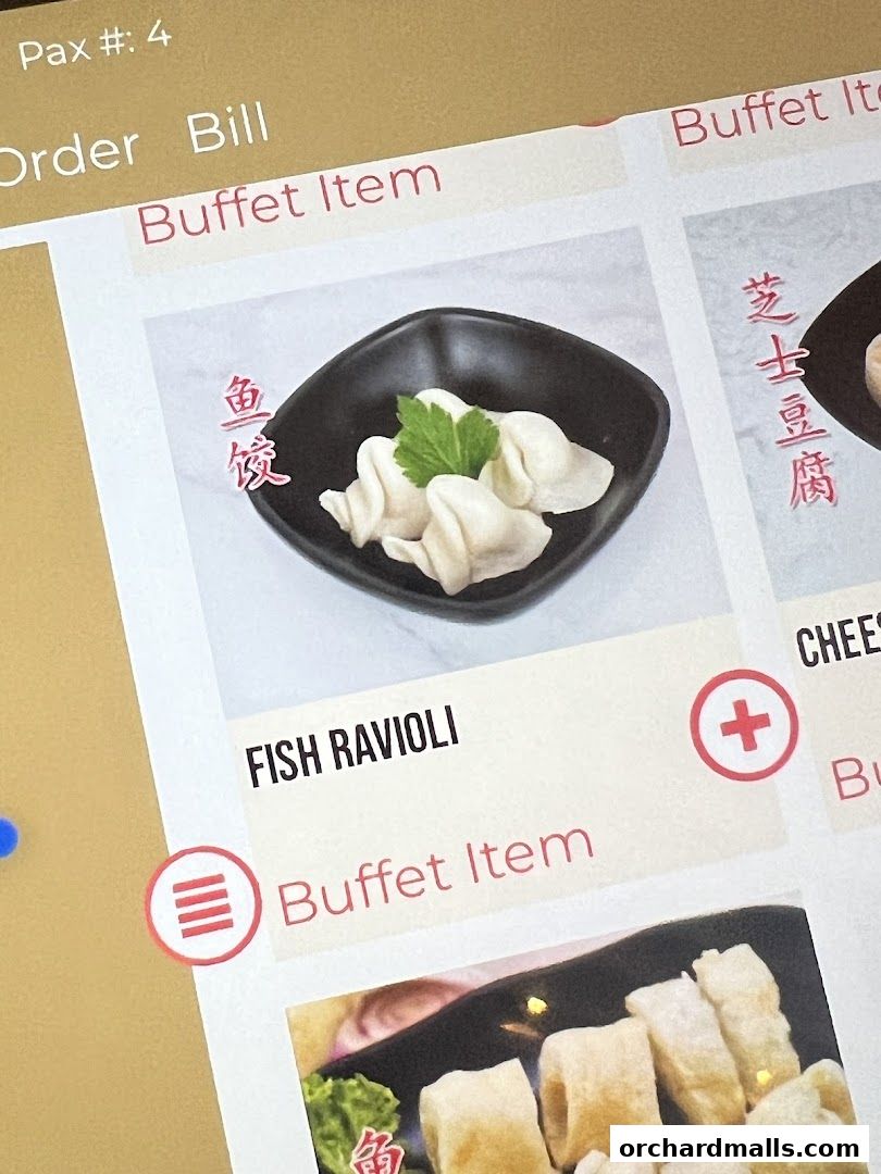 A digital menu displaying buffet items, including fish ravioli and cheese tofu.