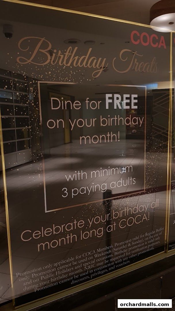 A sign for COCA Takashimaya S.C. advertising birthday treats and free dining.