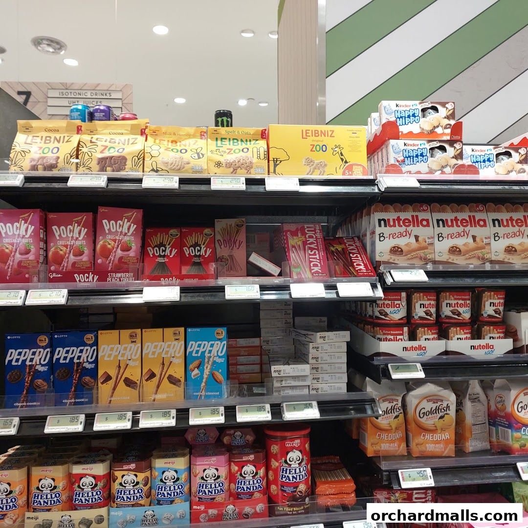 Shelves stocked with various snacks like Pocky, Pepero, Hello Panda, and Nutella.