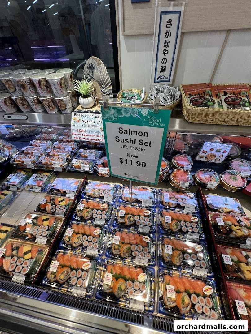 A display of fresh sushi and sashimi sets, with a special offer on a Salmon Sushi Set.