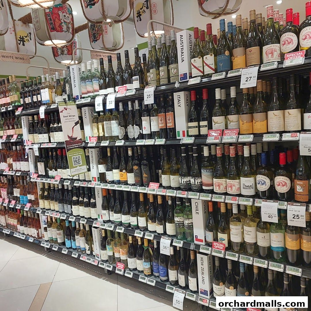 A wide selection of wine bottles displayed on shelves in a retail store.