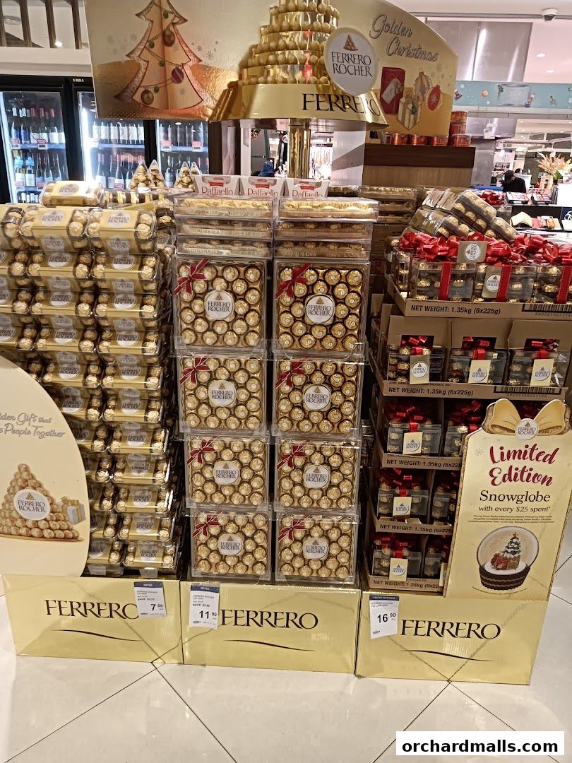 A large display of Ferrero Rocher chocolates in various gift boxes and sizes.