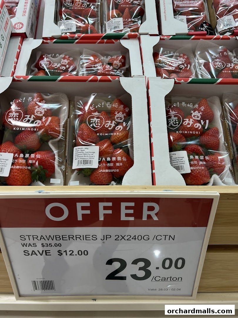 A display of Japanese strawberries with a prominent "OFFER" sign detailing a sale.