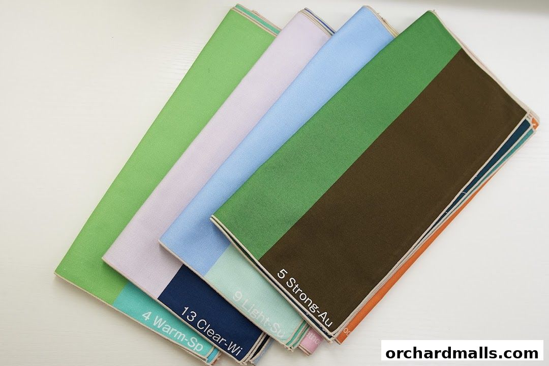 A collection of color swatch cards with different shades and labels.