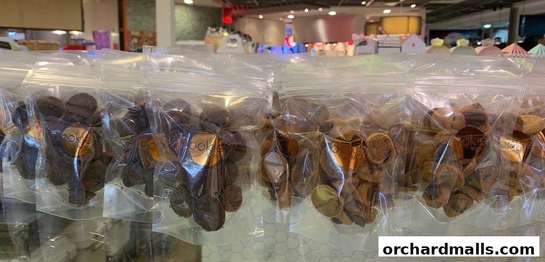 Bags of assorted cookies from Cookie Mixx displayed on a shelf.