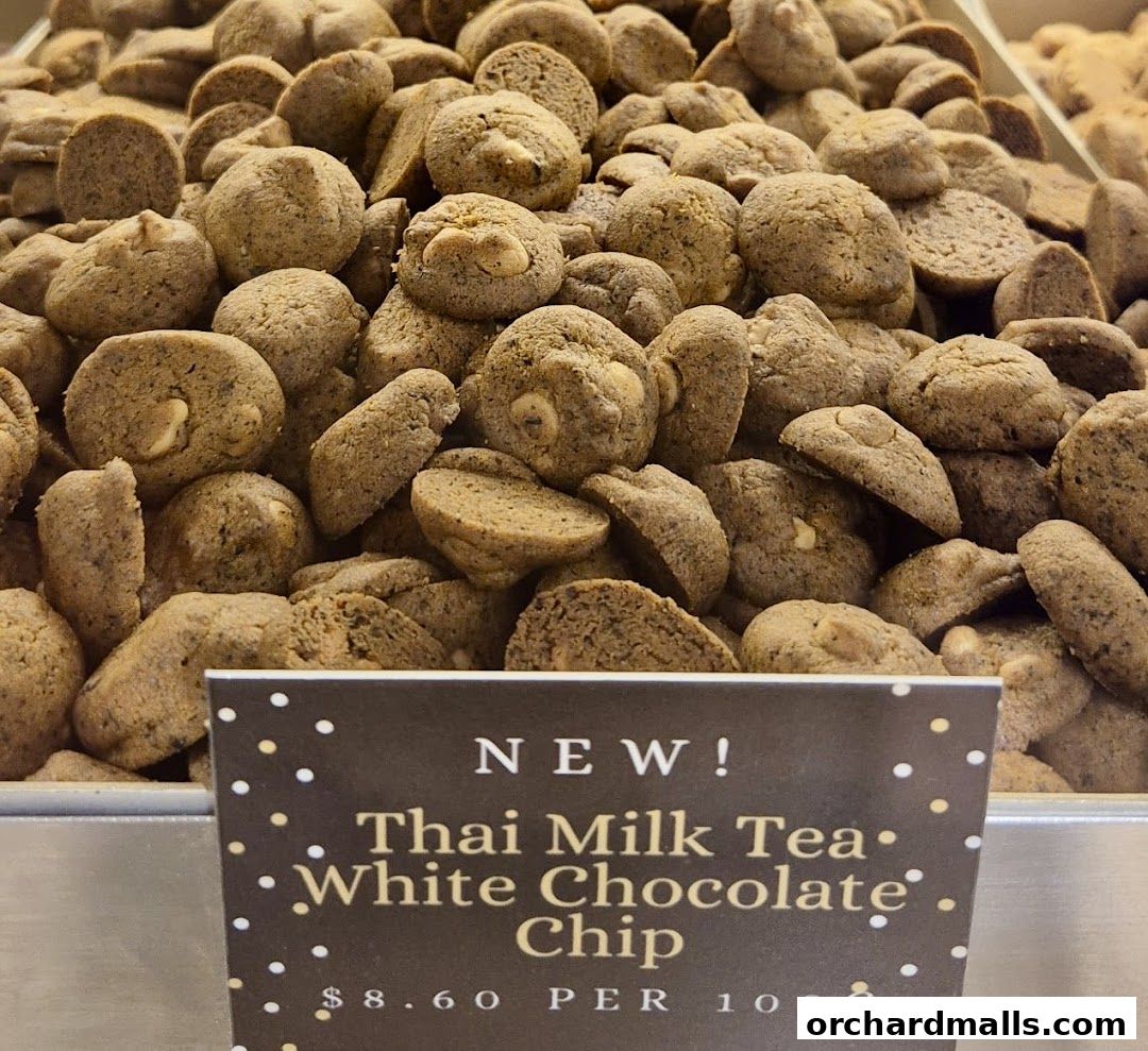 A close-up shot of many Thai Milk Tea White Chocolate Chip cookies.