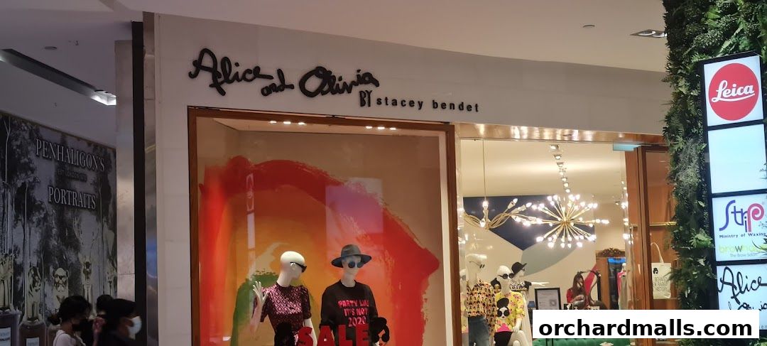 The storefront of Alice + Olivia by Stacey Bendet, featuring mannequins in the window display.