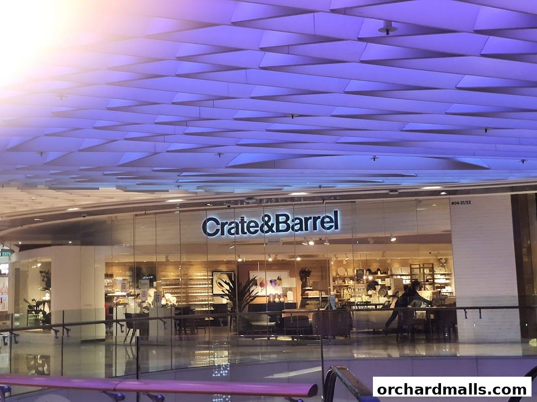 The Crate & Barrel store front with its interior displays visible through the glass.