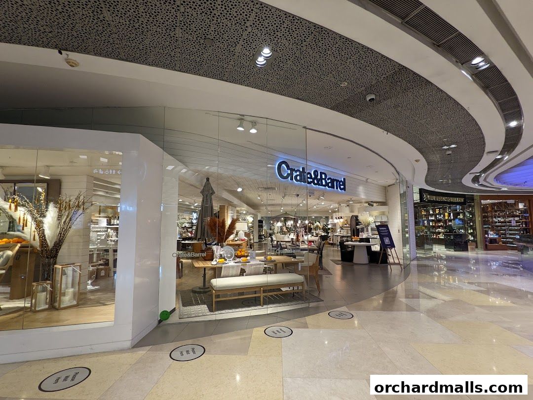 The Crate & Barrel store entrance with displays of home furnishings and decor.