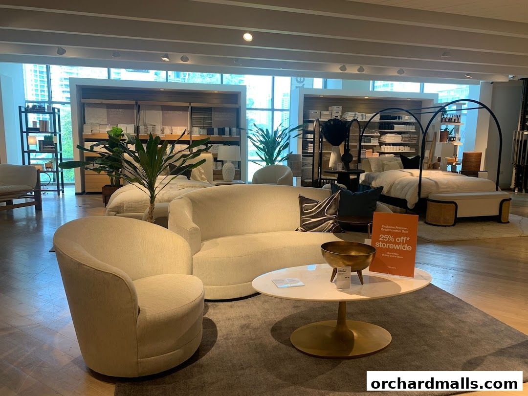 Interior shot of a Crate and Barrel store showcasing living room and bedroom furniture.
