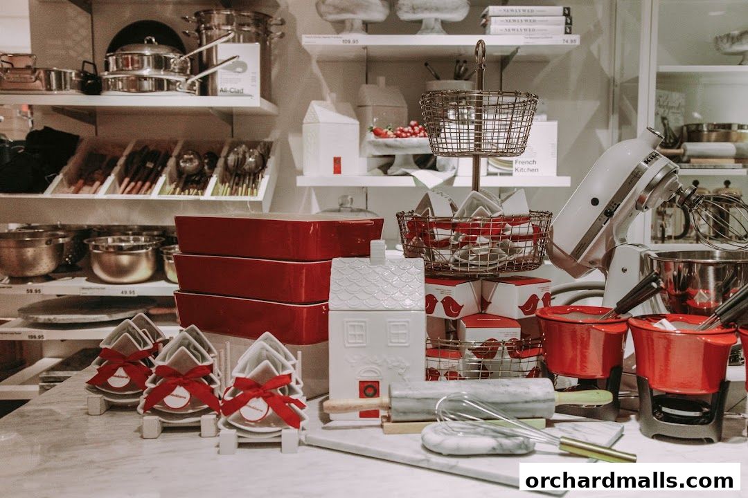 A display of kitchenware, including cookware, baking dishes, and decorative items.