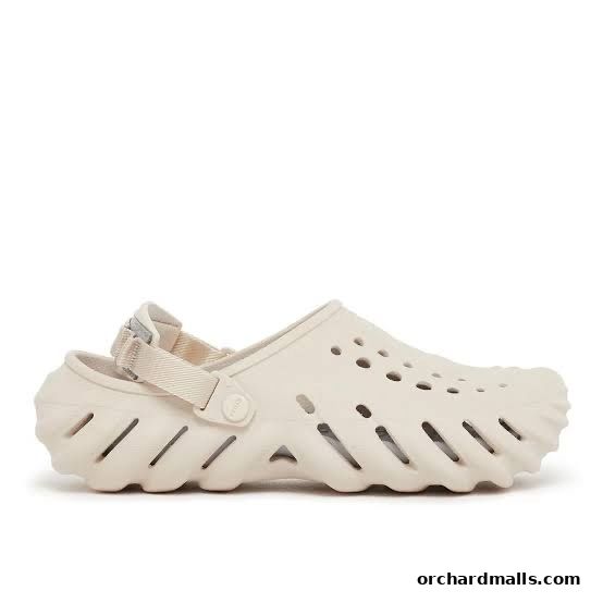 A single beige Crocs clog with a strap and distinctive cutouts on a white background.