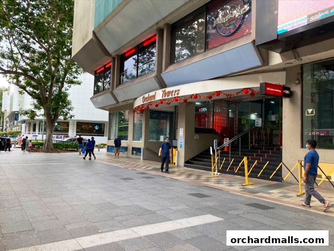 The entrance to Orchard Towers, a building with shops and a DBS bank branch.